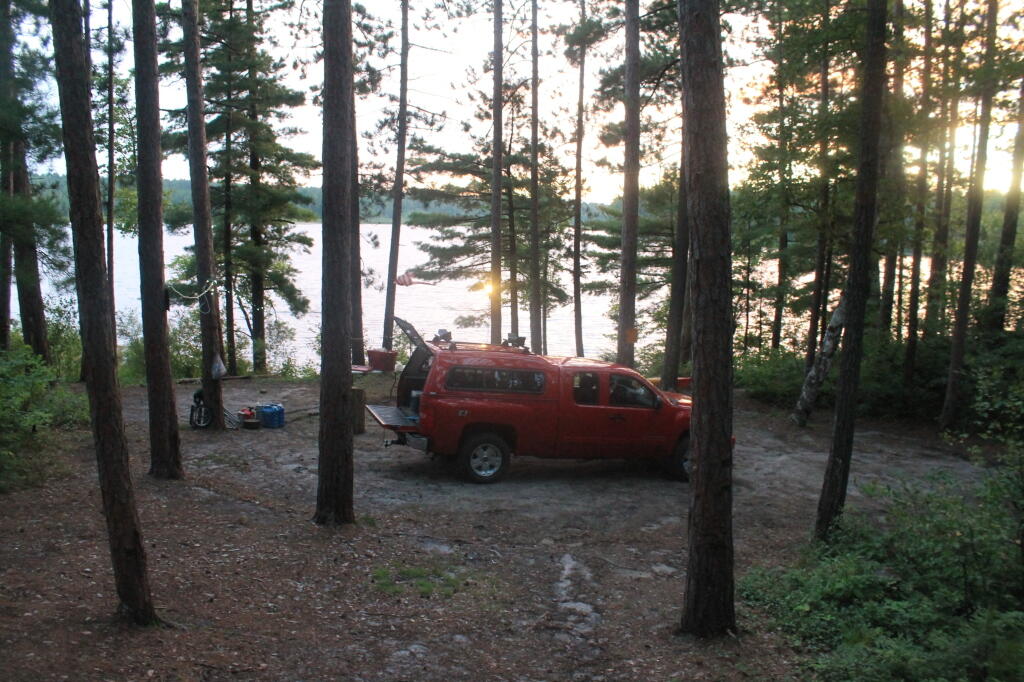 Photo: Campsite with Lake Beyond It Photo: Campsite with Lake Beyond It
