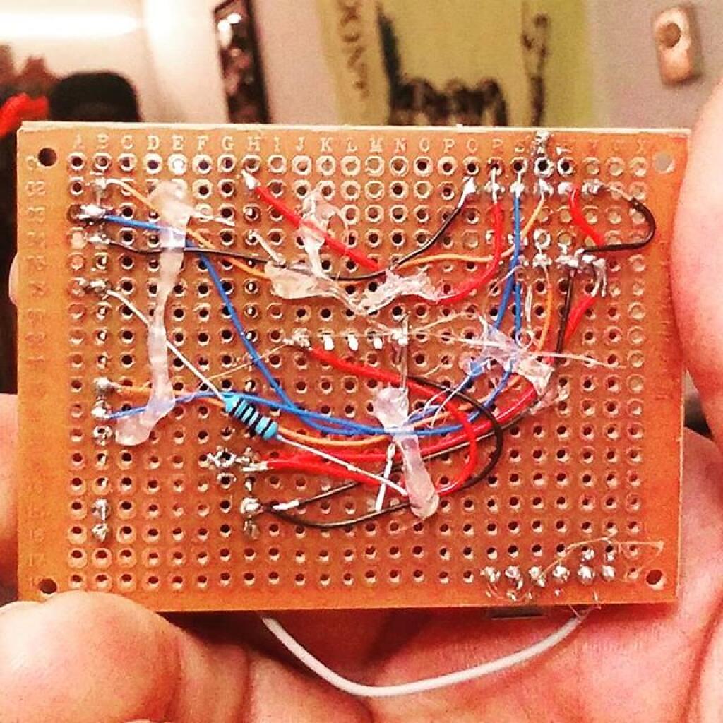 Photo: Backside of GPS Logger, Potted with Hot Glue to keep wires in place